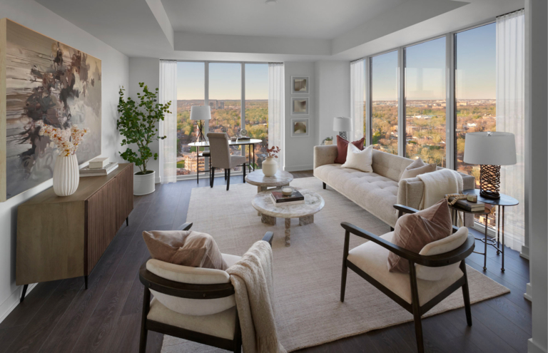 Modern living room interior with large windows, stylish furniture, and decorative elements, showcasing a bright and inviting space for ADI Developments' digital strategy.