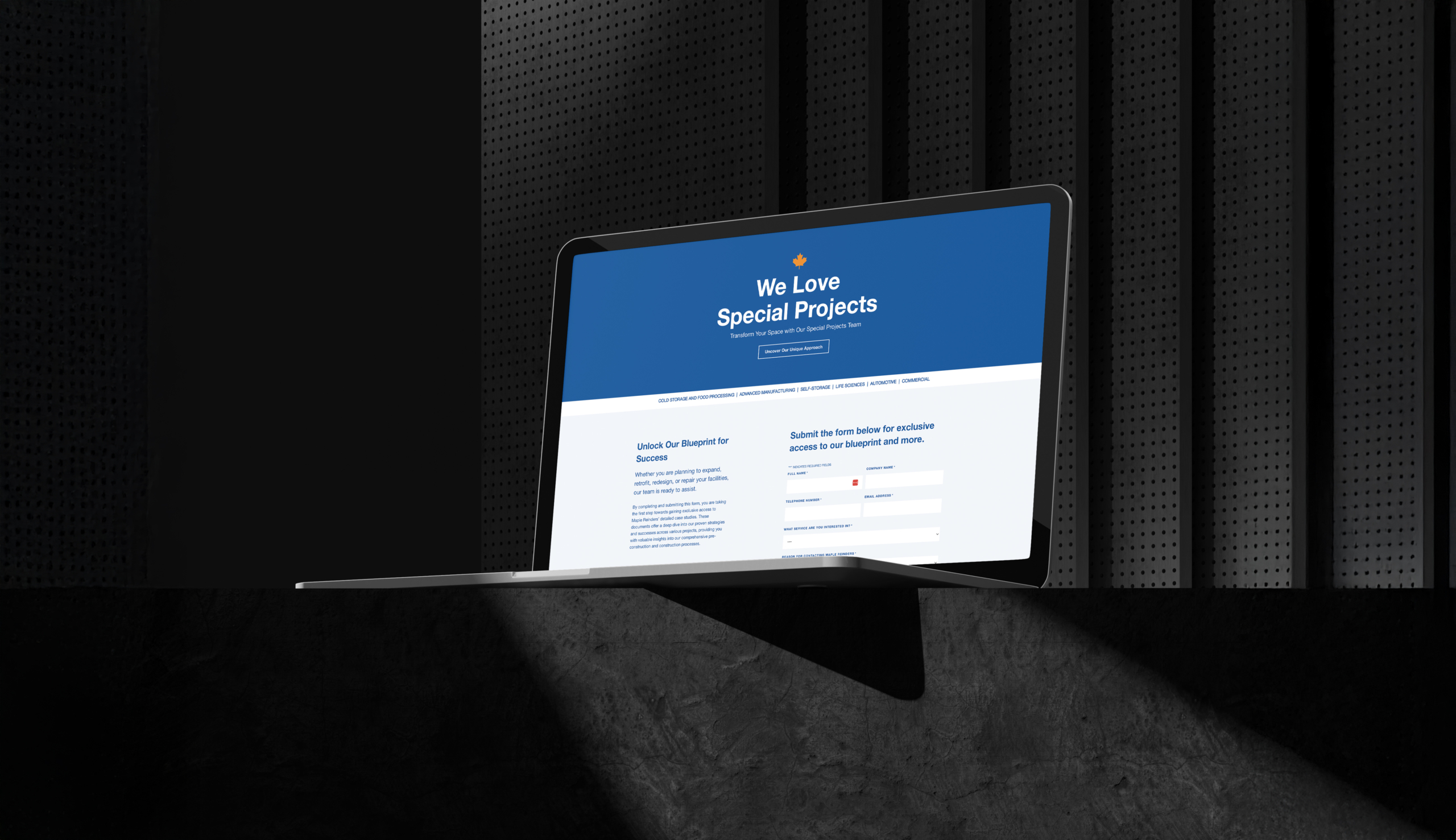 Laptop displaying Maple Reinders' "We Love Special Projects" landing page, featuring service offerings in cold storage, food processing, and advanced manufacturing, against a dark background.