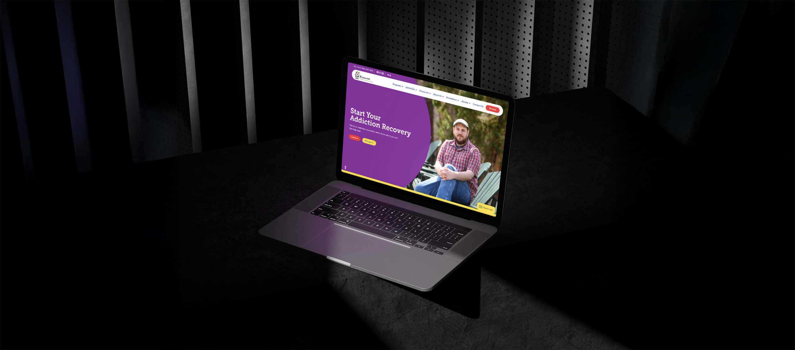 Laptop displaying Renascent's website with "Start Your Addiction Recovery" message, featuring a man sitting outdoors, emphasizing community support and recovery resources.