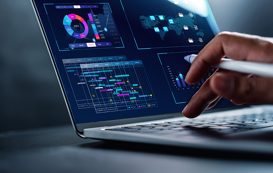 Hand interacting with a laptop displaying colorful data visualizations, charts, and analytics, representing research and analysis for consumer insights and marketing strategies.