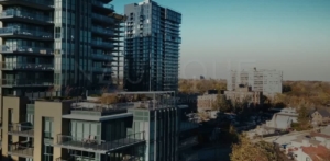 Aerial view of Nautique's modern architecture and lakefront location, showcasing premium finishes and panoramic surroundings, emphasizing the sophisticated lifestyle offered by Adi Developments.