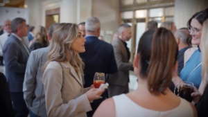 Networking event attendees engaging in conversation at WEHBA Awards Gala, showcasing camaraderie and community spirit.