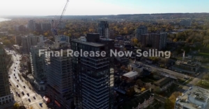 Aerial view of urban skyline featuring modern buildings and a construction crane, with overlay text "Final Release Now Selling," highlighting real estate opportunities in Burlington.